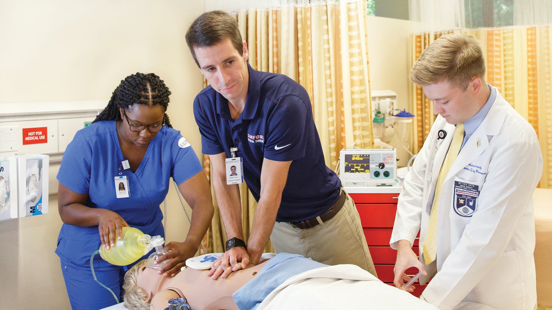 Health Sciences Students Working on Mannequin