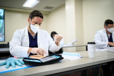 masked male nursing student experimenting SD08200749 cta