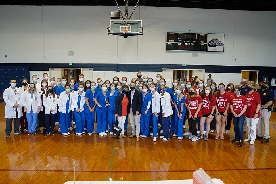 A group picture of the Samford students and employees staffing the COVID-19 vaccination clinic on campus.