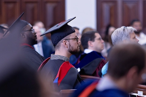 students sitting in hodges during graduation