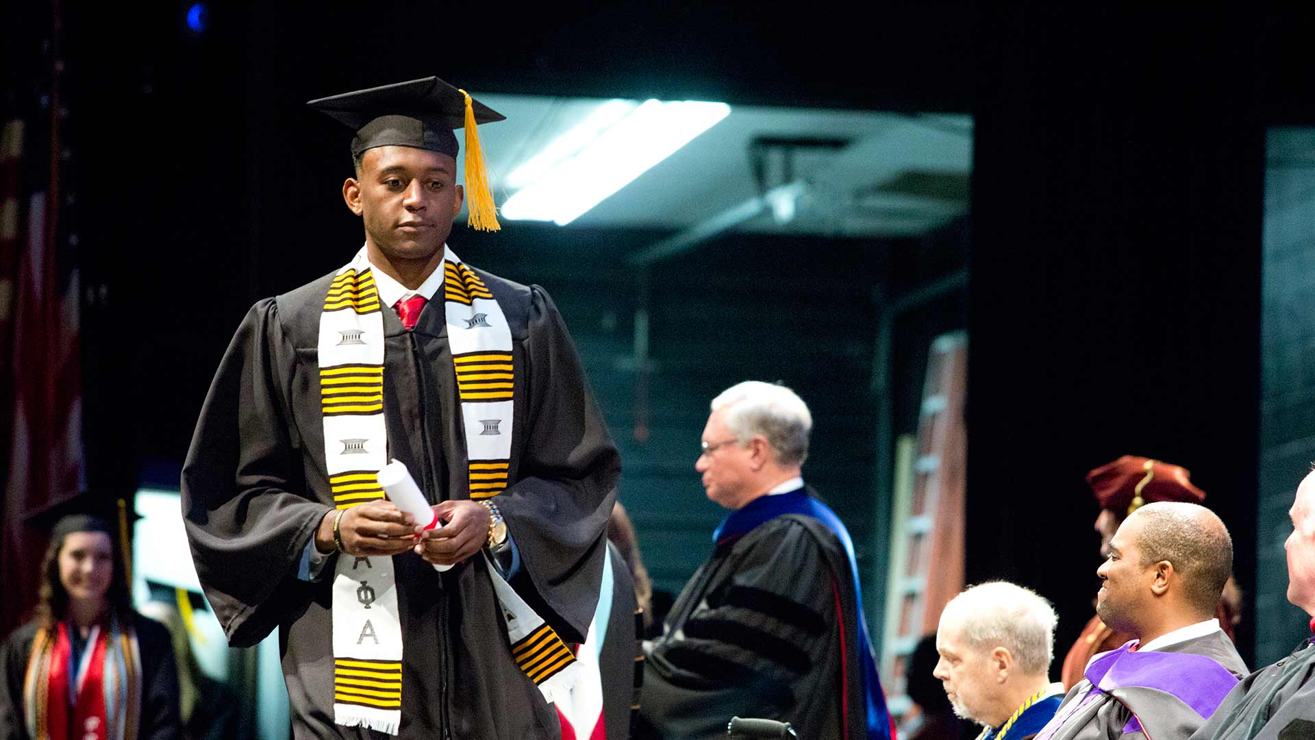 black male student graduating introspective expression