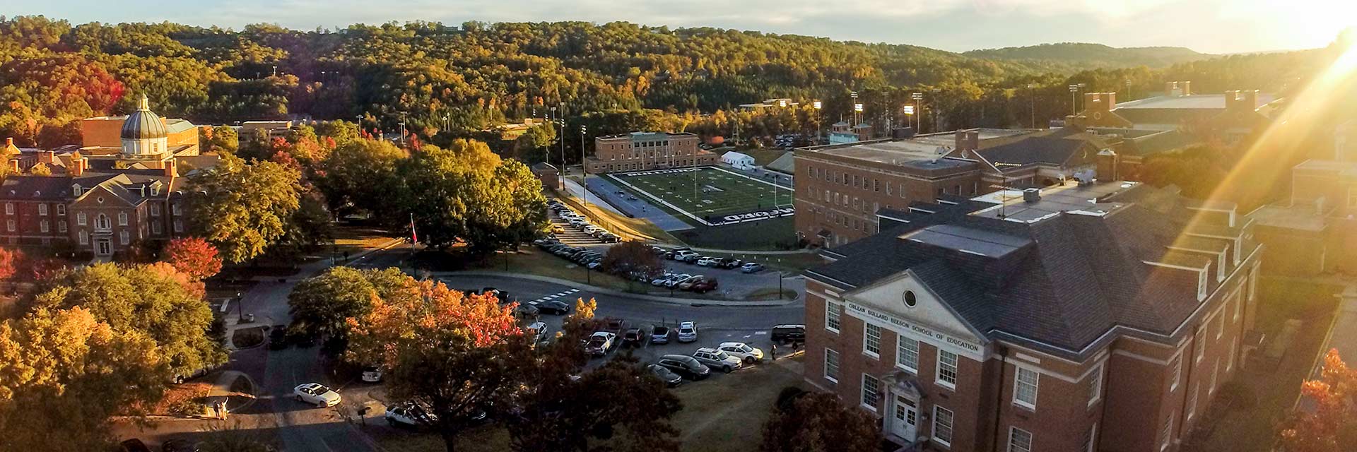 fall campus education divinity football field header