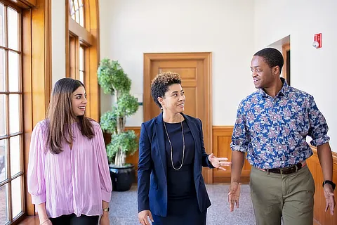 law professor walking with two students