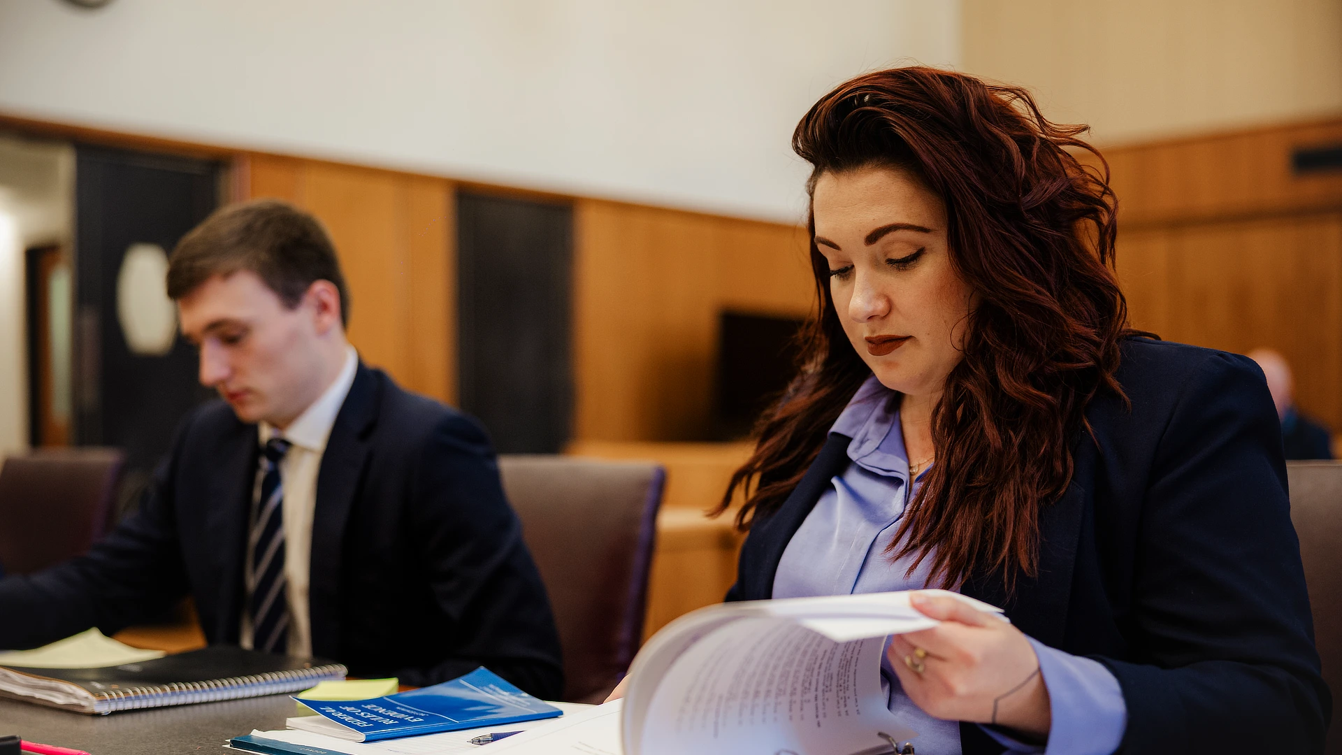 female law student studying for trial
