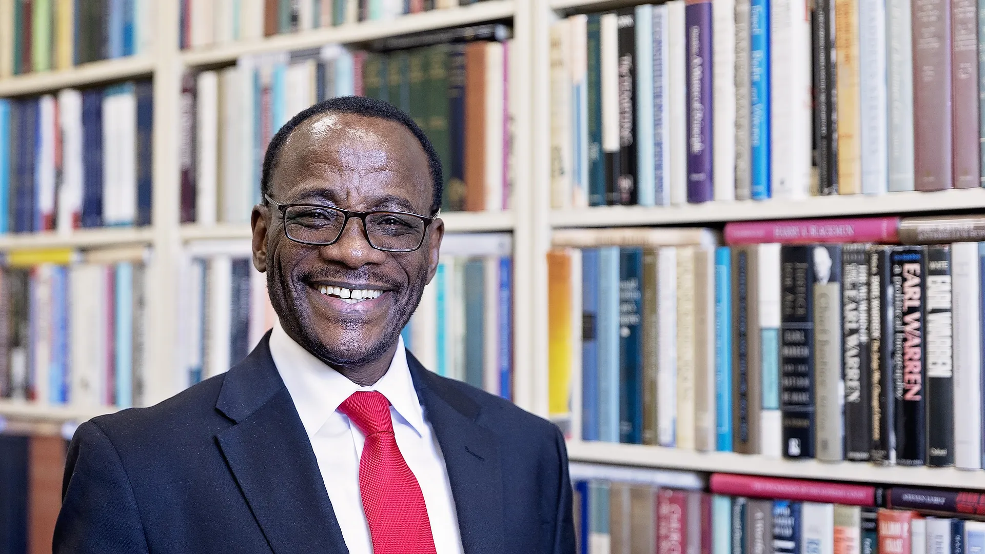 male professor in the library