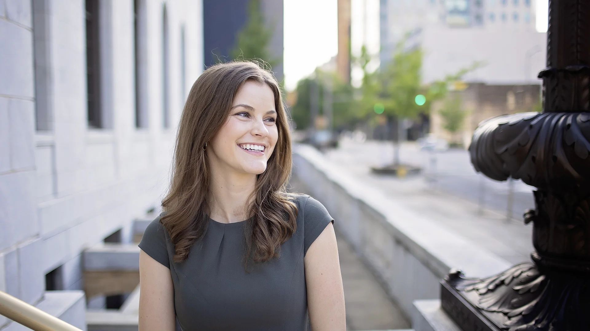 smiling woman outside courthouse