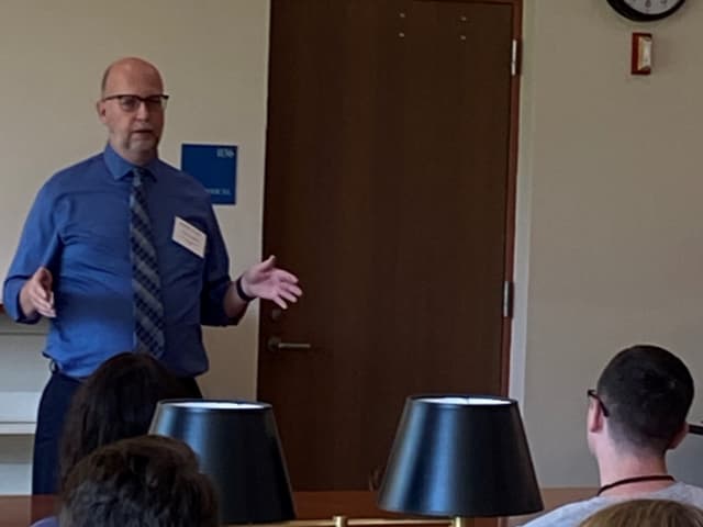 Greg Laughlin greeting new students