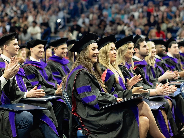 law students sitting at graduation 2024