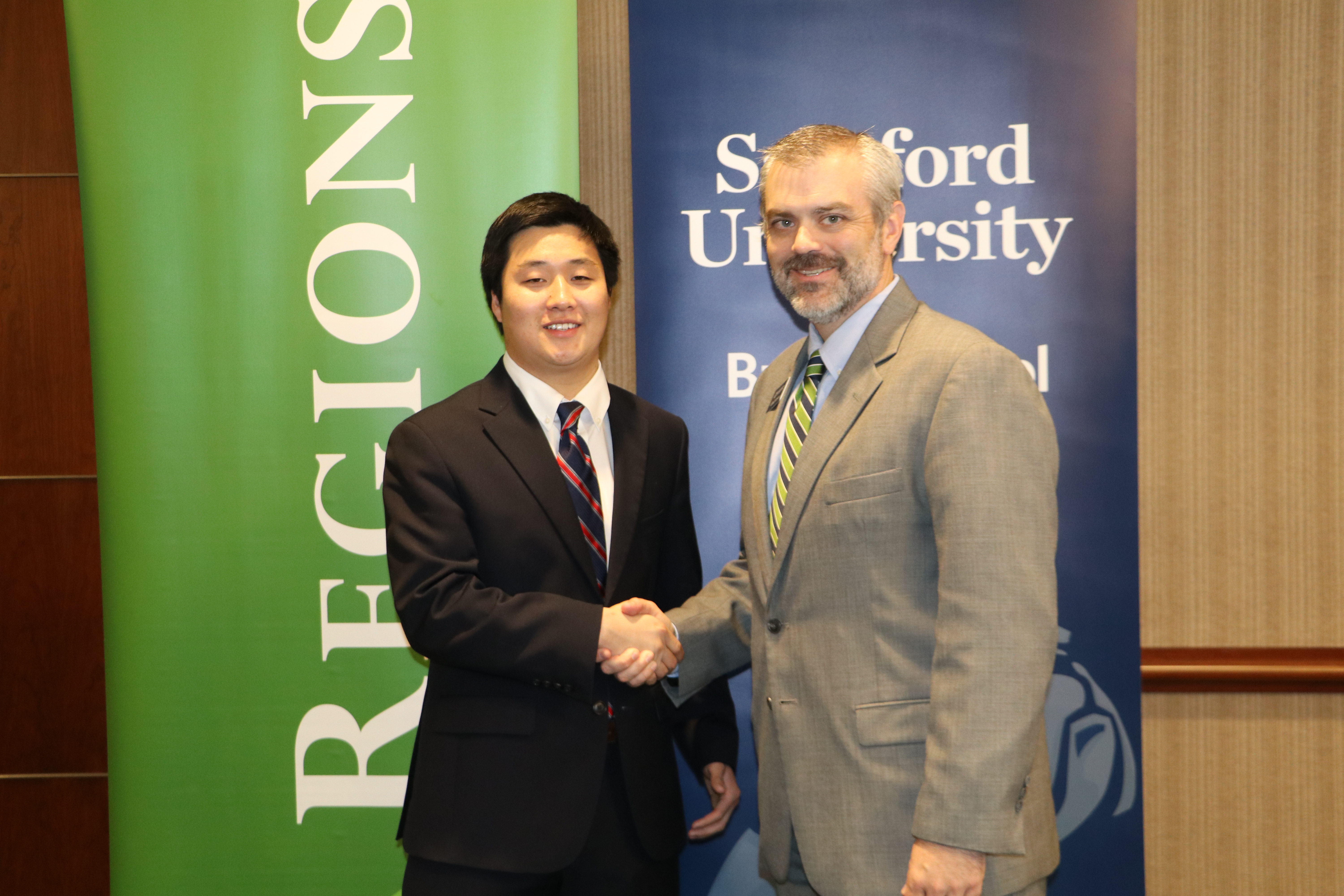 Alex Tian and Associate Dean Chad Carson