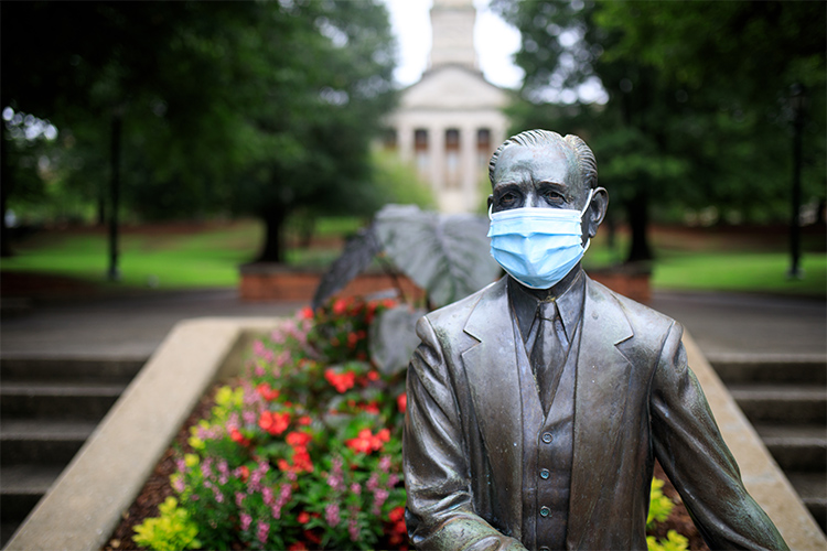 Mr. Beeson statue wearing a mask