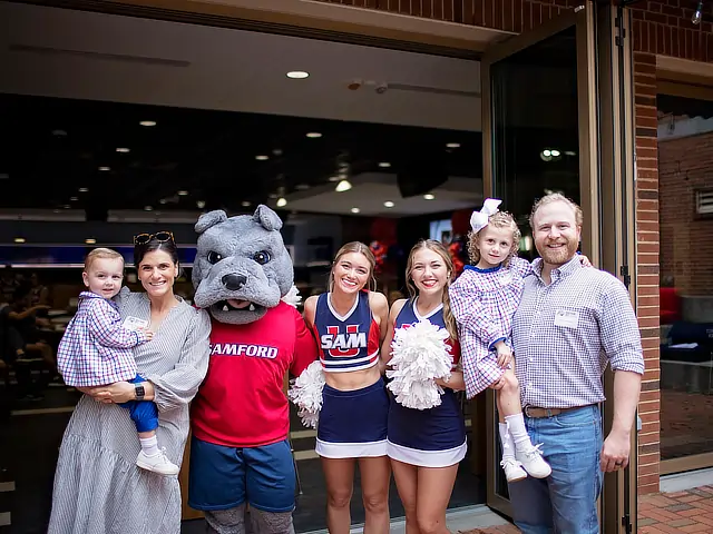 homecoming family with Sam and cheerleaders