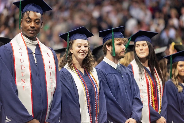 Three Samford Students Standing Together At the Winter Graduation