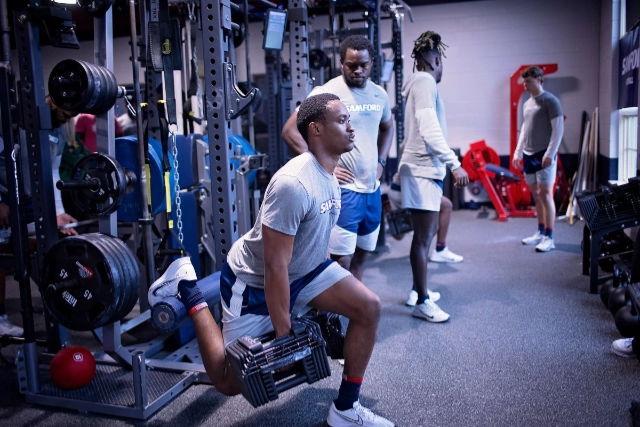 student athlete lifting weights