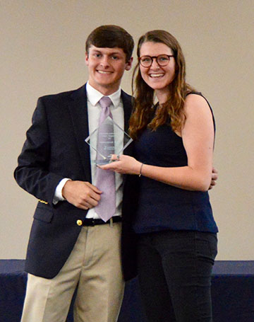 Lexi Gilbert, right, International Club president