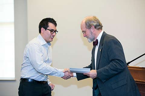 male student receiving certificate cta