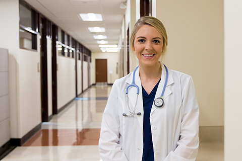 nursing student standing in hall