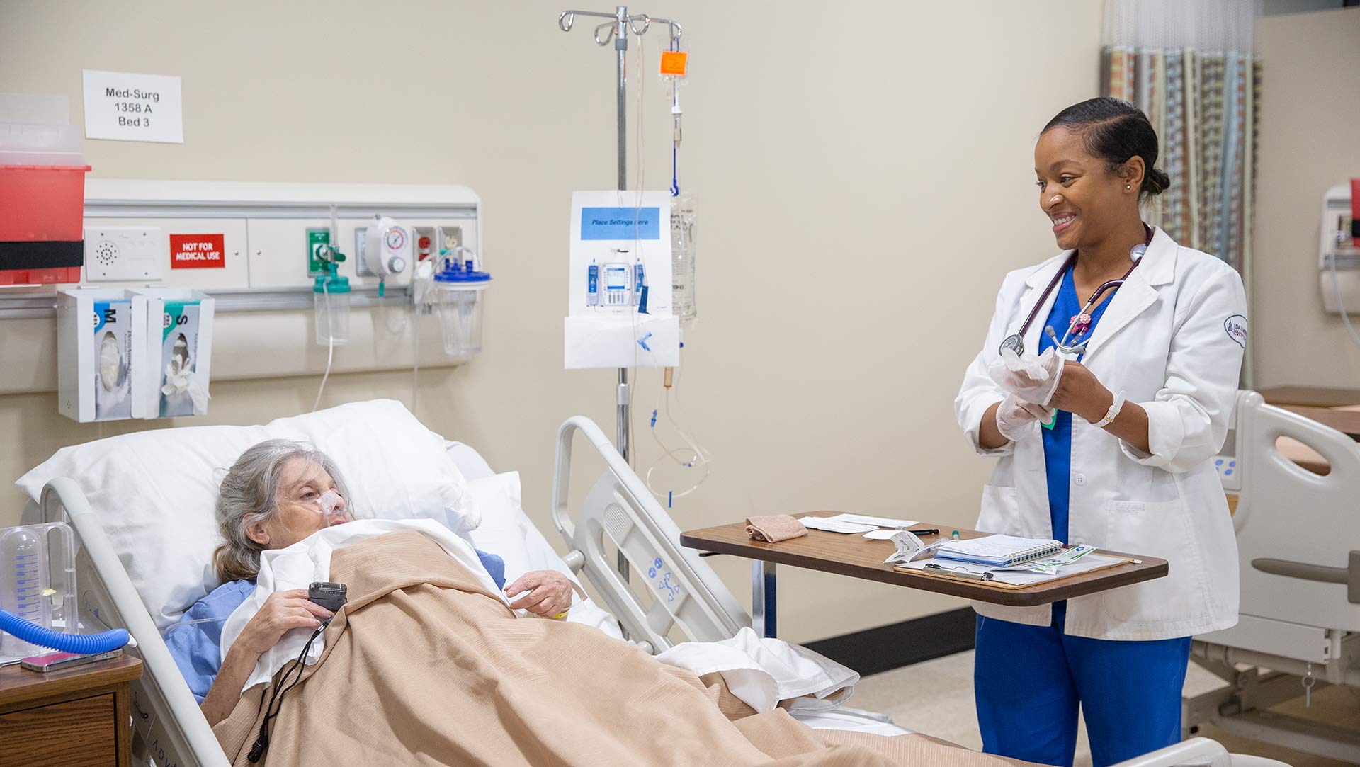 female nursing student with patient