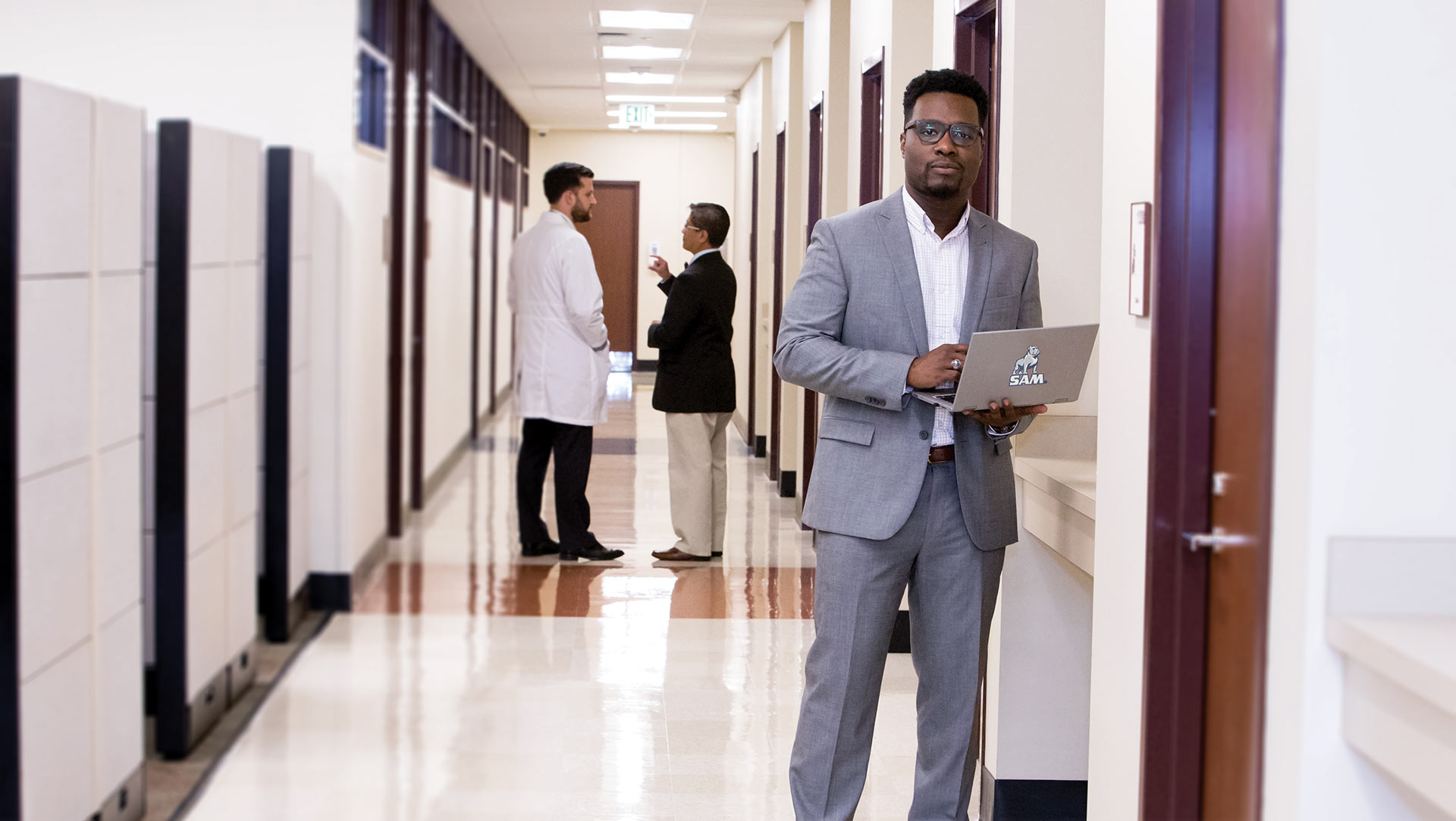 male graduate nursing student with laptop