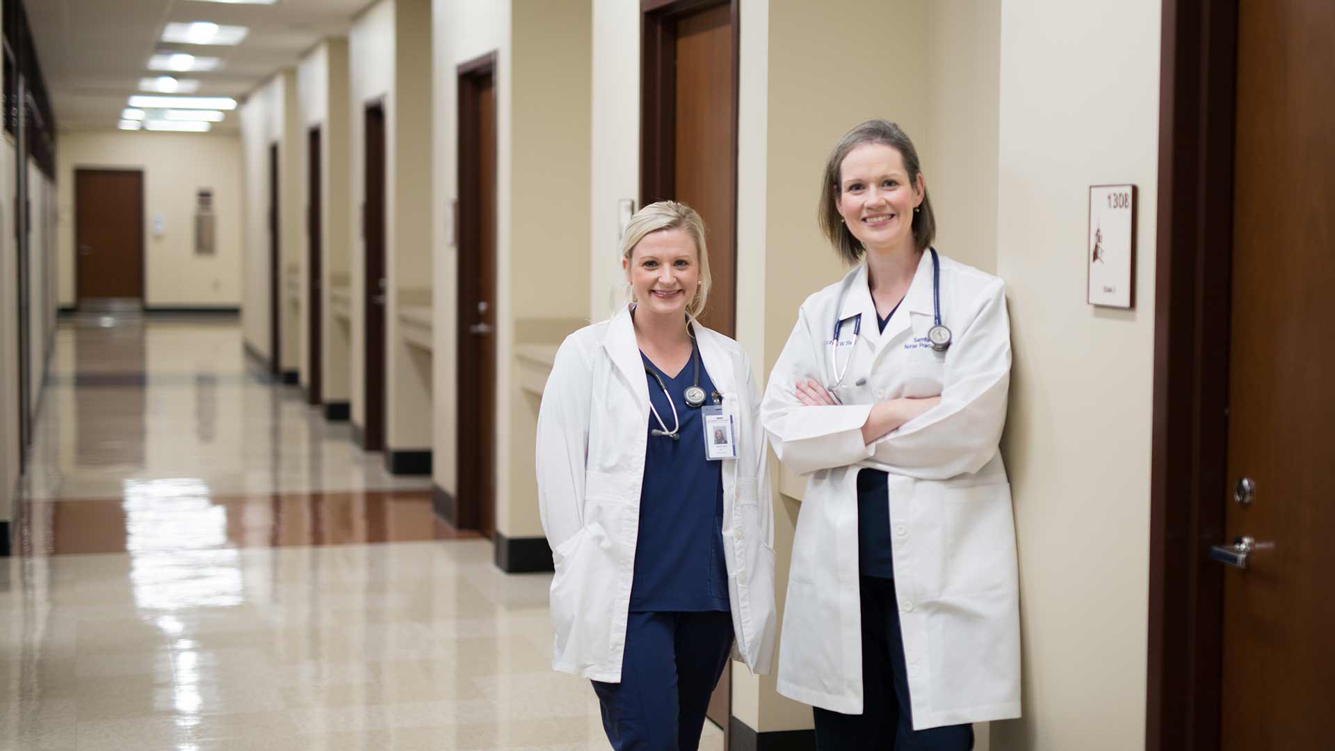nurse practitioner student and teacher in hallway