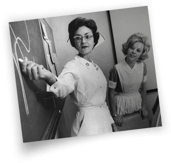 photo of nurse writing on blackboard