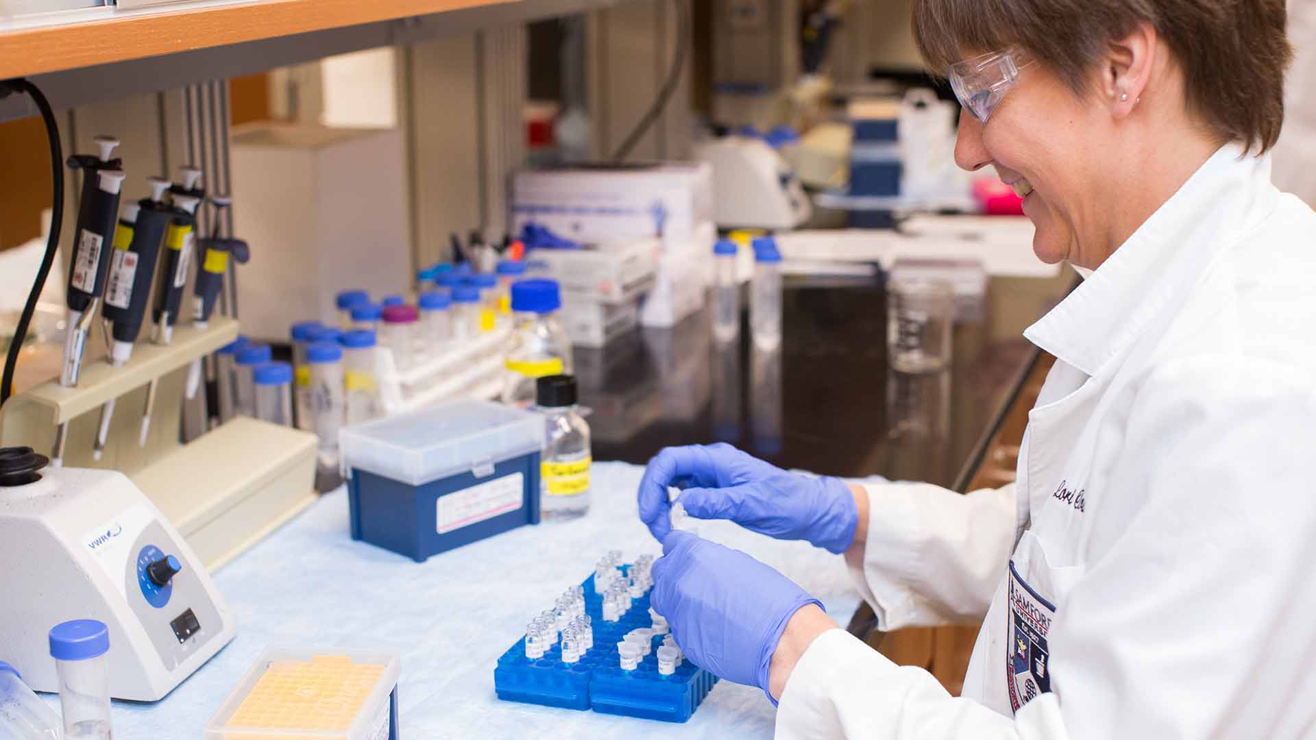 white female research associate in lab