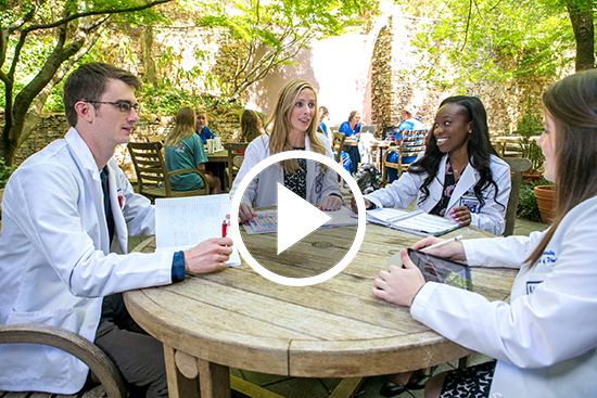 Pharmacy students sitting in Samford's Atrium