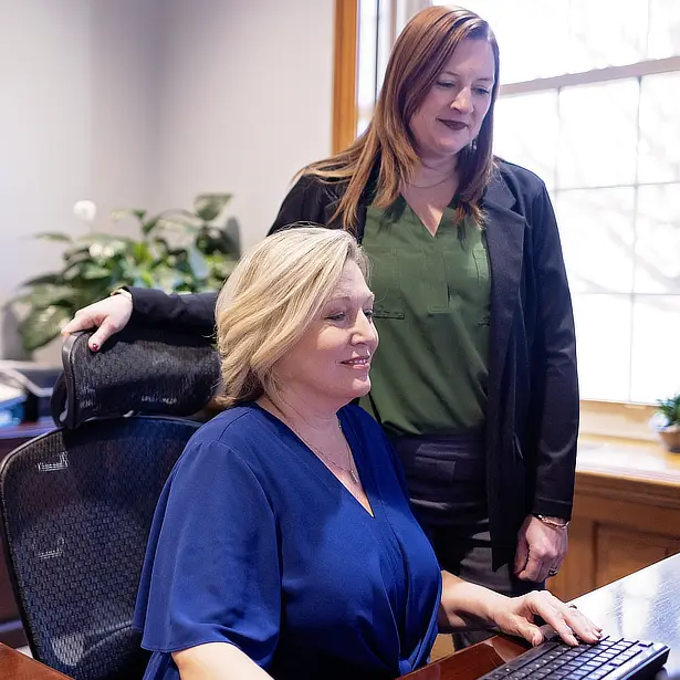 Kim Evans and Julie Myers at desk 