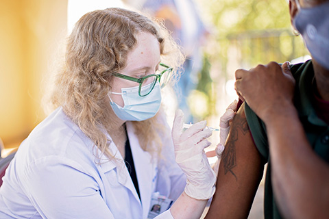 Photo of student giving shot