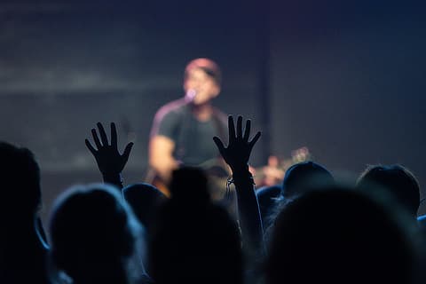 upraised hands in worship