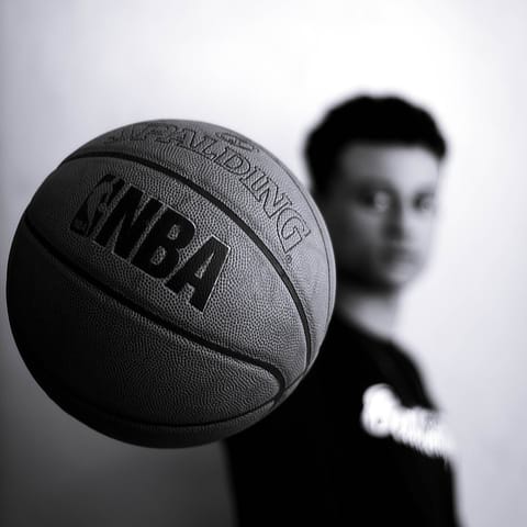 man holding nba basketball