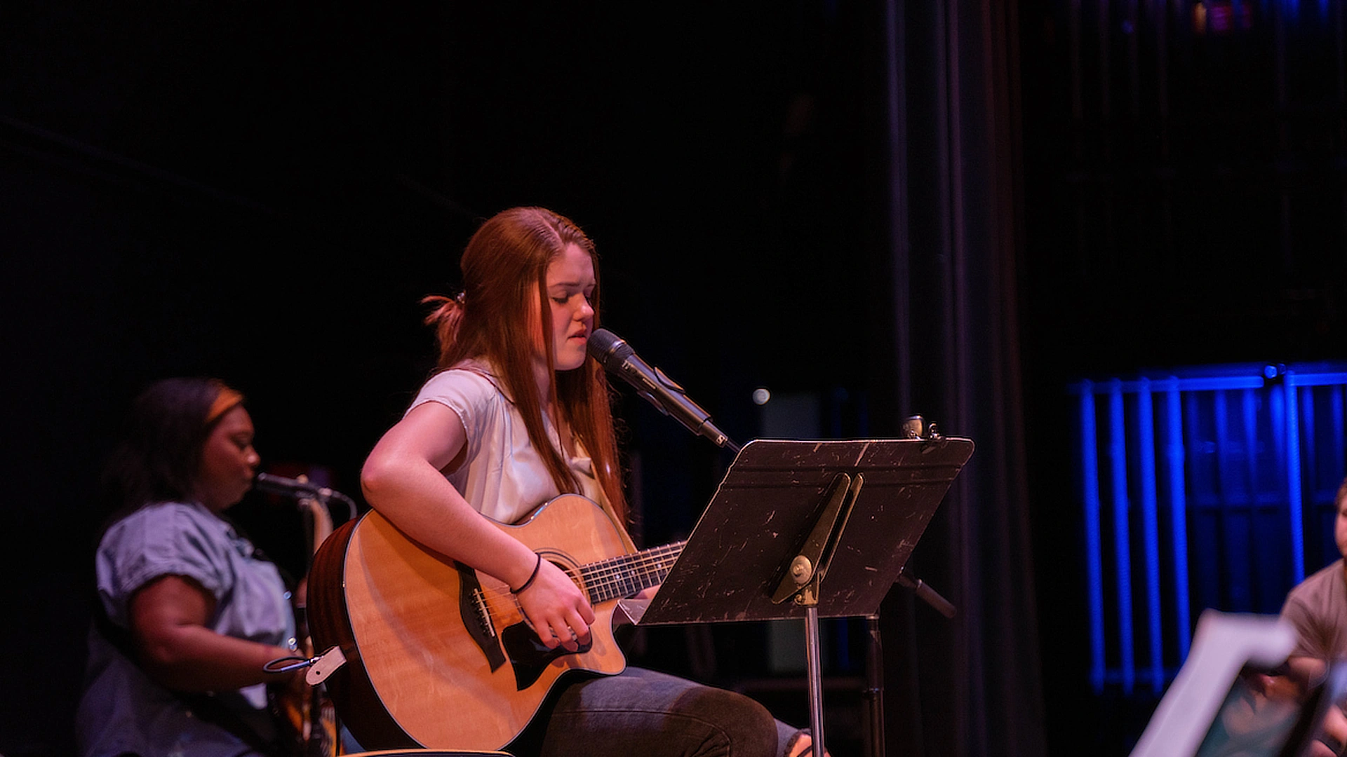 Female Worship Arts Student Playing Guitar