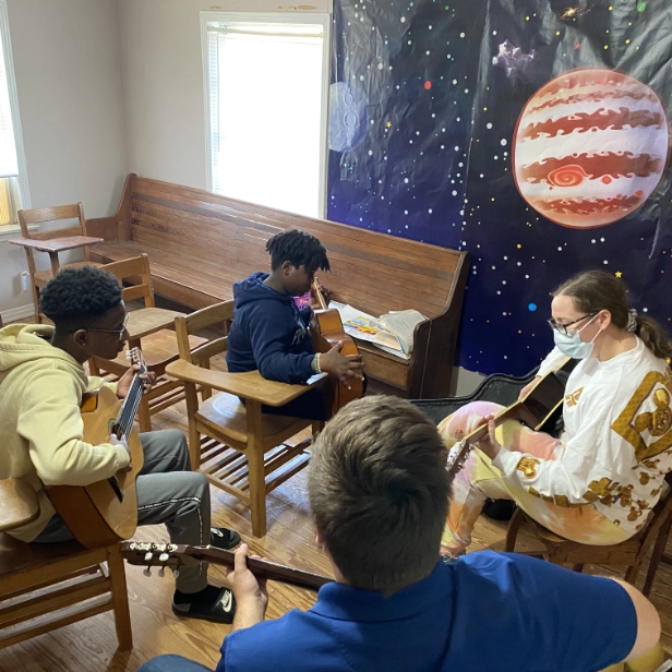 MGS&A students learning guitar